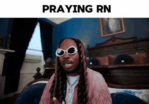 a picture of a man wearing sunglasses with the words praying rn below it