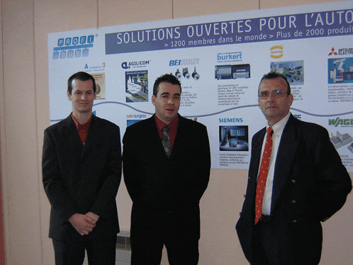 three men are standing in front of a poster that says solutions ouvertes pour l' auto