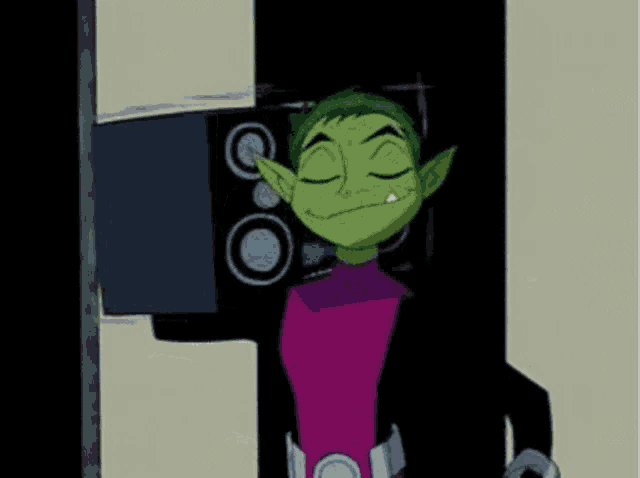 a cartoon character is standing in front of a speaker and smiling .
