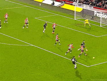a soccer game is being played on a field with an advertisement for pension confidence in the background