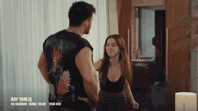 a man and a woman are standing next to each other in a room with the words bay yanlis on the bottom