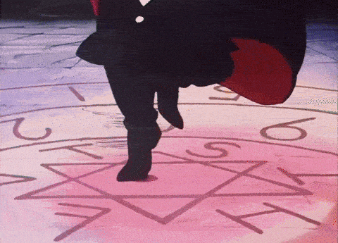 a person 's feet are standing on a pink circle with the letters a and t on it