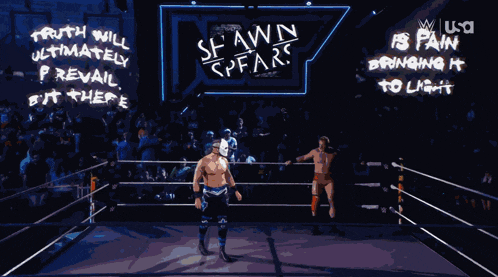 a wrestling ring with a sign that says truth will ultimately prevail but there is pain bringing it to light