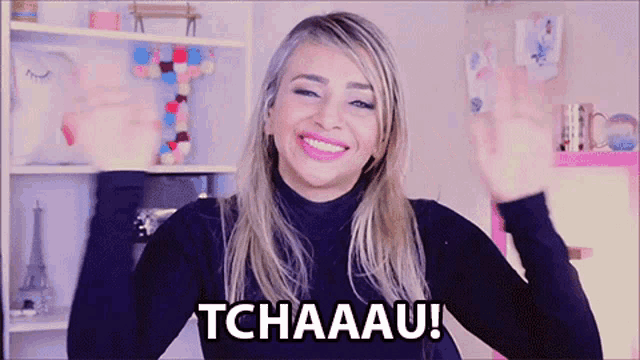 a woman in a black turtleneck says tchaau