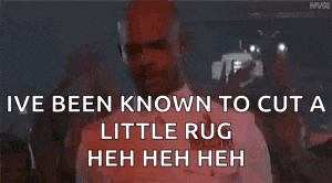 a man is holding a gun and says `` i 've been known to cut a little rug heh heh heh ''