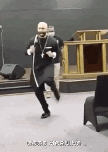 a man is dancing in a church with the words `` good morning '' written below him .
