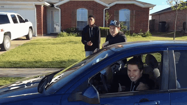 a man in a mt hat is sitting in a car