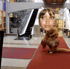 a woman with a cat in front of her face