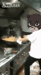 a person wearing a cat mask is cooking in a kitchen