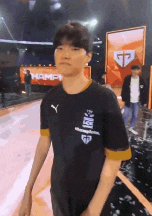 a man wearing a black shirt that says champions on it