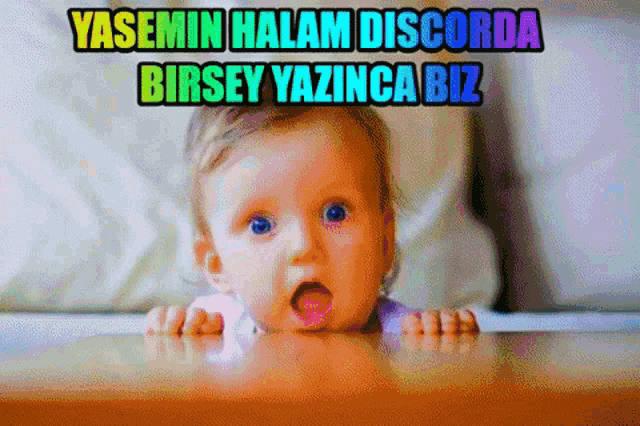 a baby with a surprised look on his face and the words yasemin halam discorda birsey yazinca biz below him