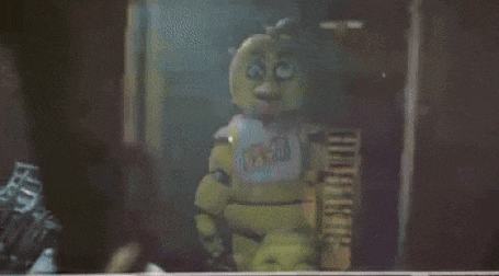 chica from five nights at freddy 's standing in a dark room