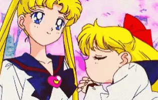 a couple of anime girls standing next to each other .
