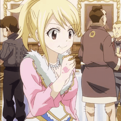 a girl in a pink dress stands in a room with other people