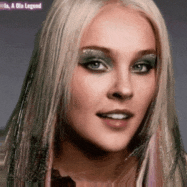 a close up of a woman 's face with the words " is a ola legend " in the corner