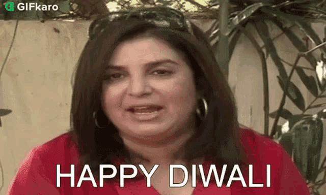 a woman in a red shirt says happy diwali .