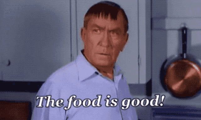 a man in a purple shirt says the food is good