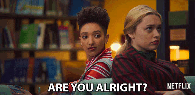 a netflix advertisement shows two girls sitting back to back