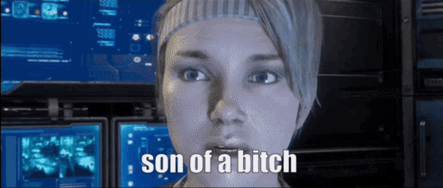 a woman says son of a bitch in front of a computer screen