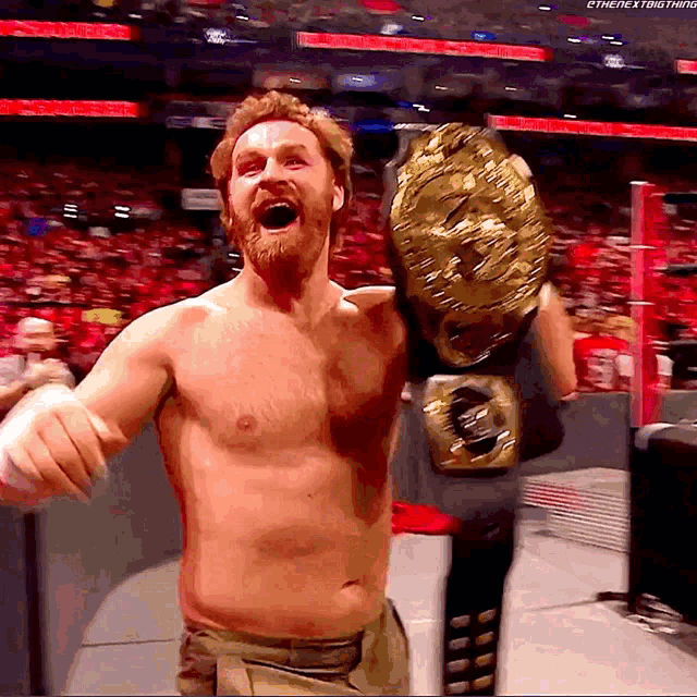 a shirtless wrestler is holding a world heavyweight wrestling championship belt