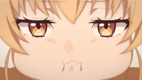 a close up of a girl 's face with a slight smile