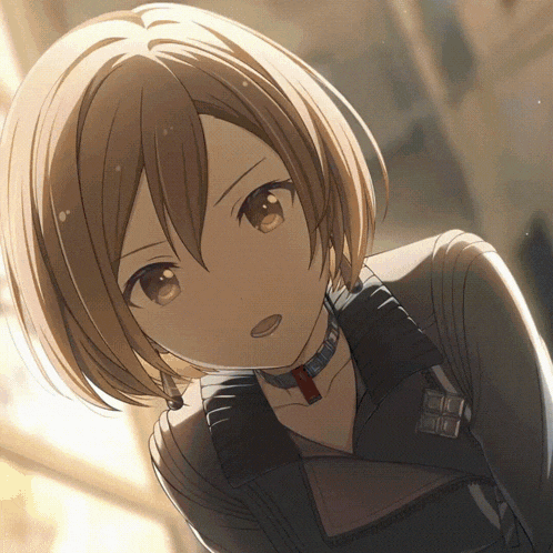 a girl with short brown hair is wearing a black jacket