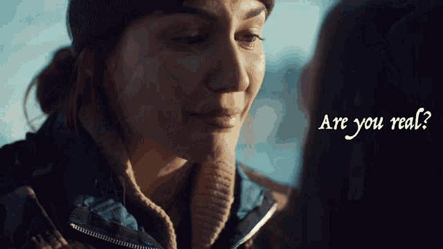 a close up of a woman 's face with the words are you real below her
