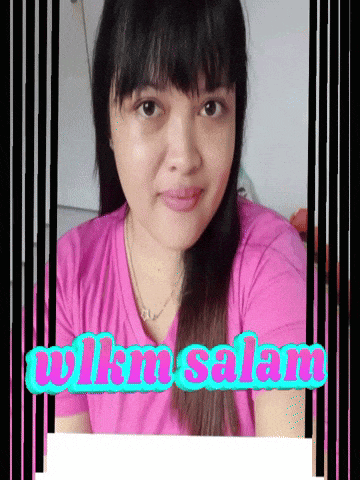 a woman in a pink shirt with the words wilm salam written on it