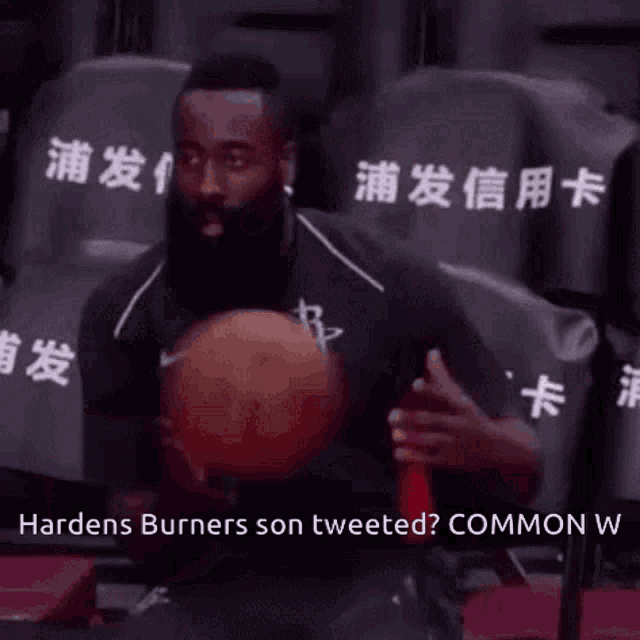 a man with a beard is sitting in a chair holding a basketball with the words hardens burners son tweeted
