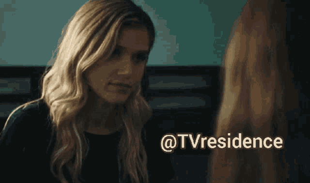 a woman is talking to another woman with the words @tvresidence written below her