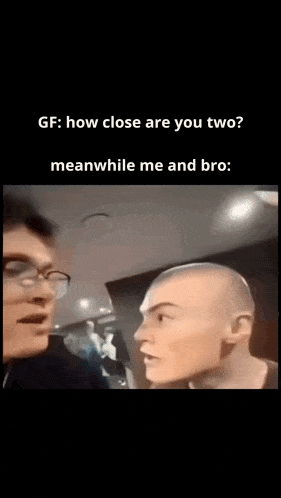 a woman with a shaved head is talking to another woman .