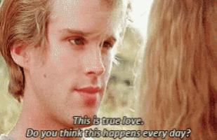 a man and a woman are looking into each other 's eyes .