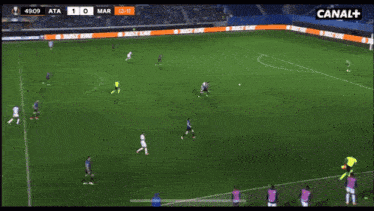 a group of people are watching a soccer game on canal plus