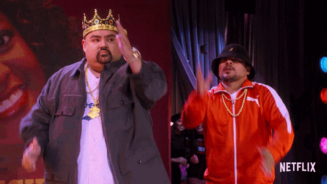 two men are dancing on a stage with a netflix logo in the corner