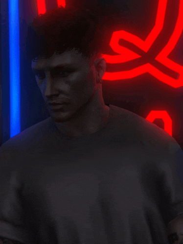 a man with a tattoo on his arm is standing in front of a red neon sign