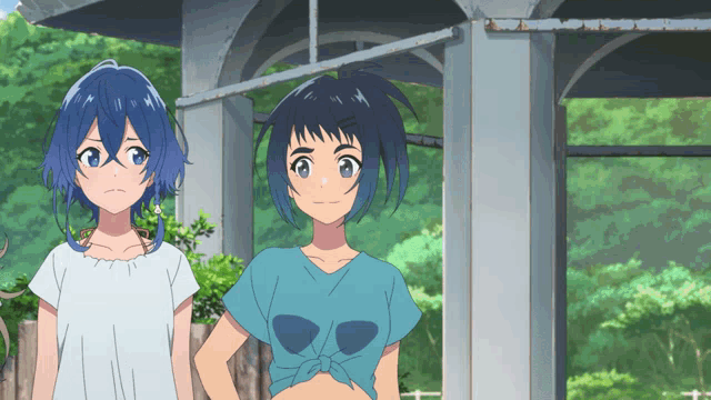 two anime girls are standing next to each other in front of a building