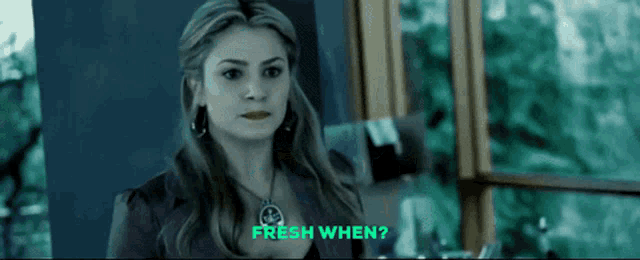 a woman in a purple jacket says fresh when in green letters