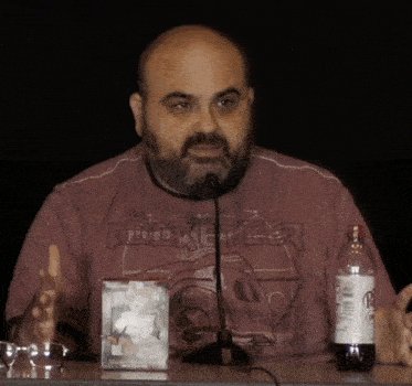 a man wearing a red shirt that says rocketeer