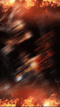 a blurred image of a fire with the word doy visible in the corner