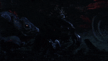 a few monsters are standing in a dark room with red lights behind them
