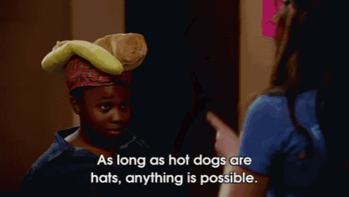 a woman wearing glasses says " as long as hot dogs are hats , anything is possible "