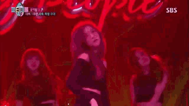 a group of people are dancing on a stage with a sbs logo in the corner