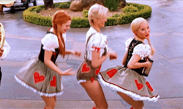 a woman in a costume with hearts on her skirt