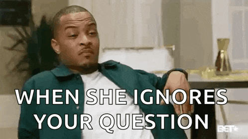 a man is sitting at a table with his hand on his elbow and says `` when she ignores your question ''