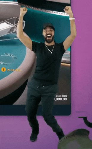 a man is dancing in front of a screen that says total bet 1,000,000