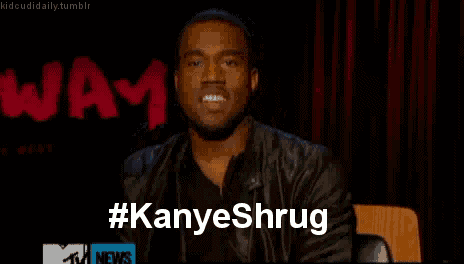 a man in a black jacket says #kanyeshrug in front of a red curtain