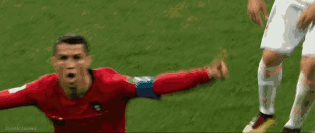 a soccer player in a red shirt with the word iconic james on the bottom