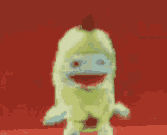 a pixelated image of a person standing on a red surface