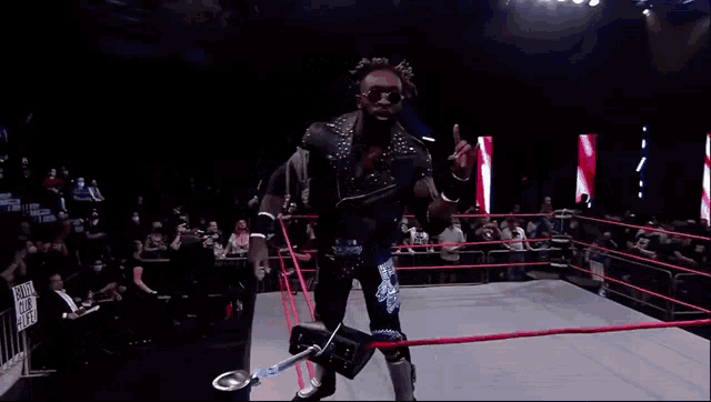 a wrestler in a ring with a sign that says i love you on it