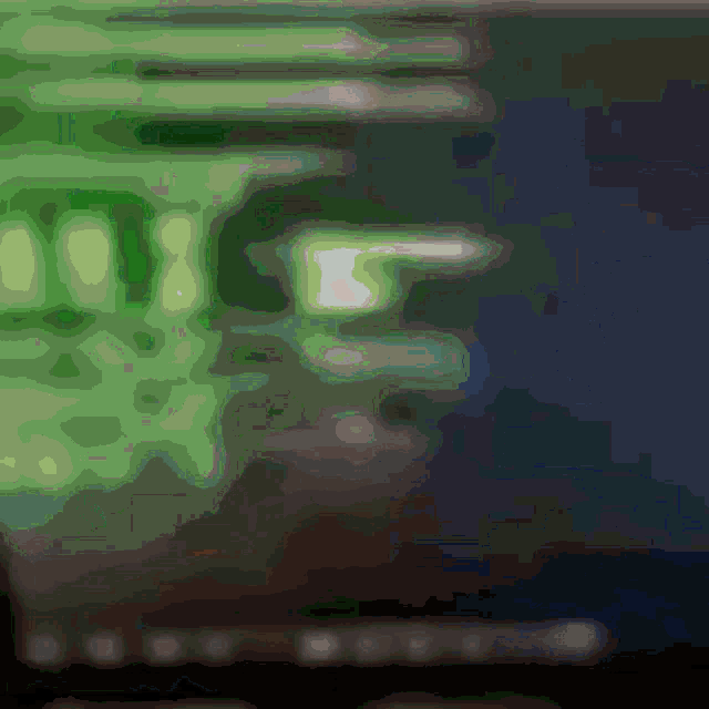 a blurred image of a green background with a few white dots